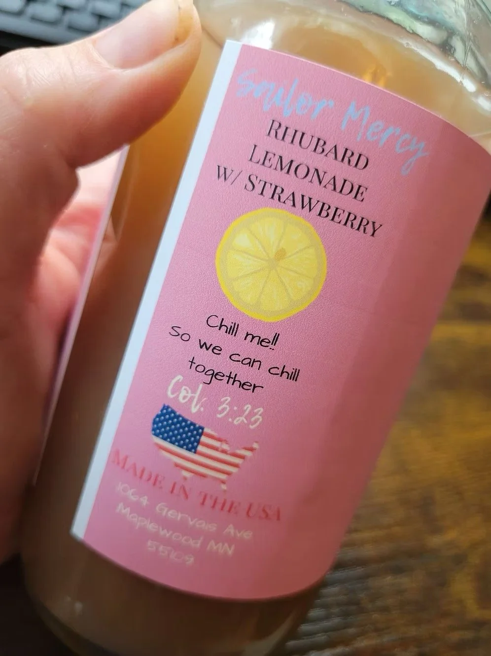 Small-batch rhubarb strawberry lemonade label detail on glass bottle