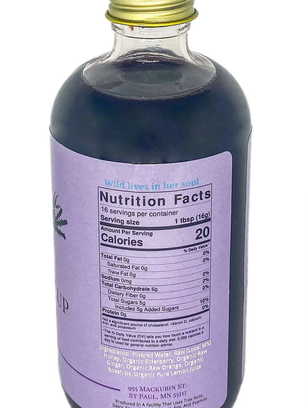Close-up of no spice elderberry syrup label showing organic ingredients and gentle formula