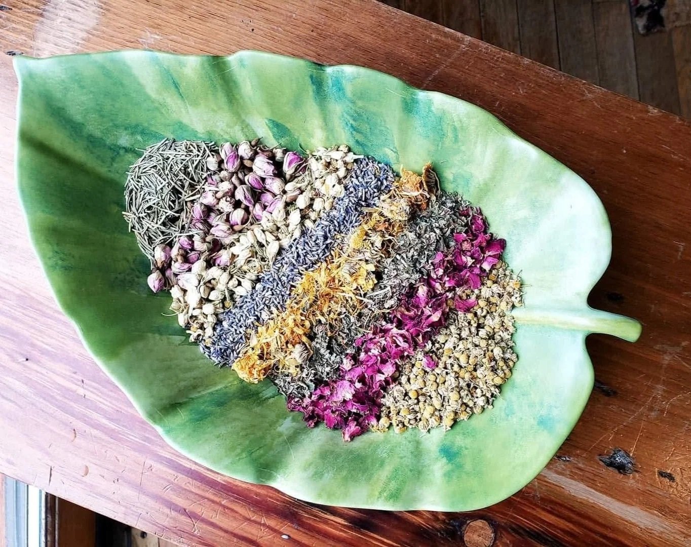 Dried herbal botanicals used in natural wellness products and herbal remedies.