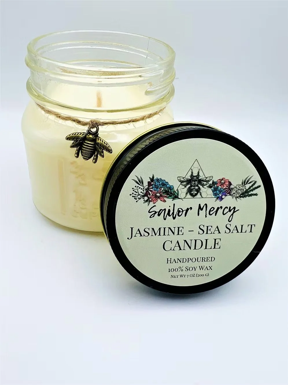 Sailor Mercy jasmine sea salt soy candle in glass jar with light coastal scent