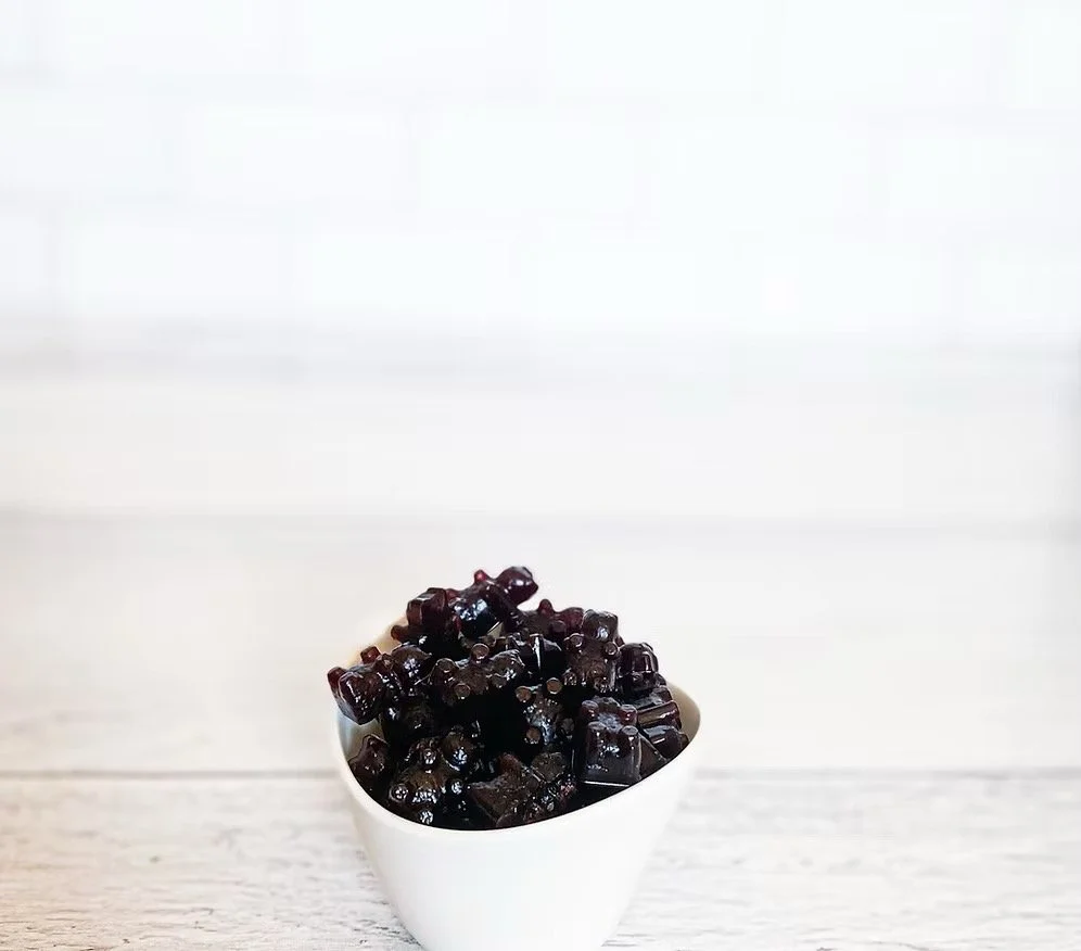Homemade elderberry gummies in bowl, dark purple immune support gummies