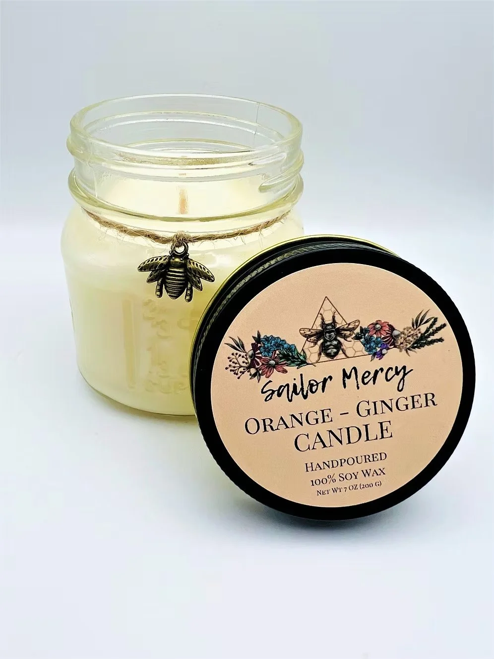 Sailor Mercy orange ginger soy wax candle in glass jar with warm citrus scent