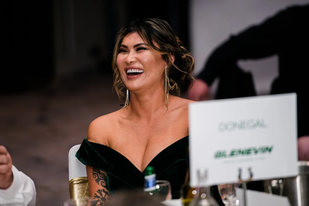 Guest at corporate event laughing