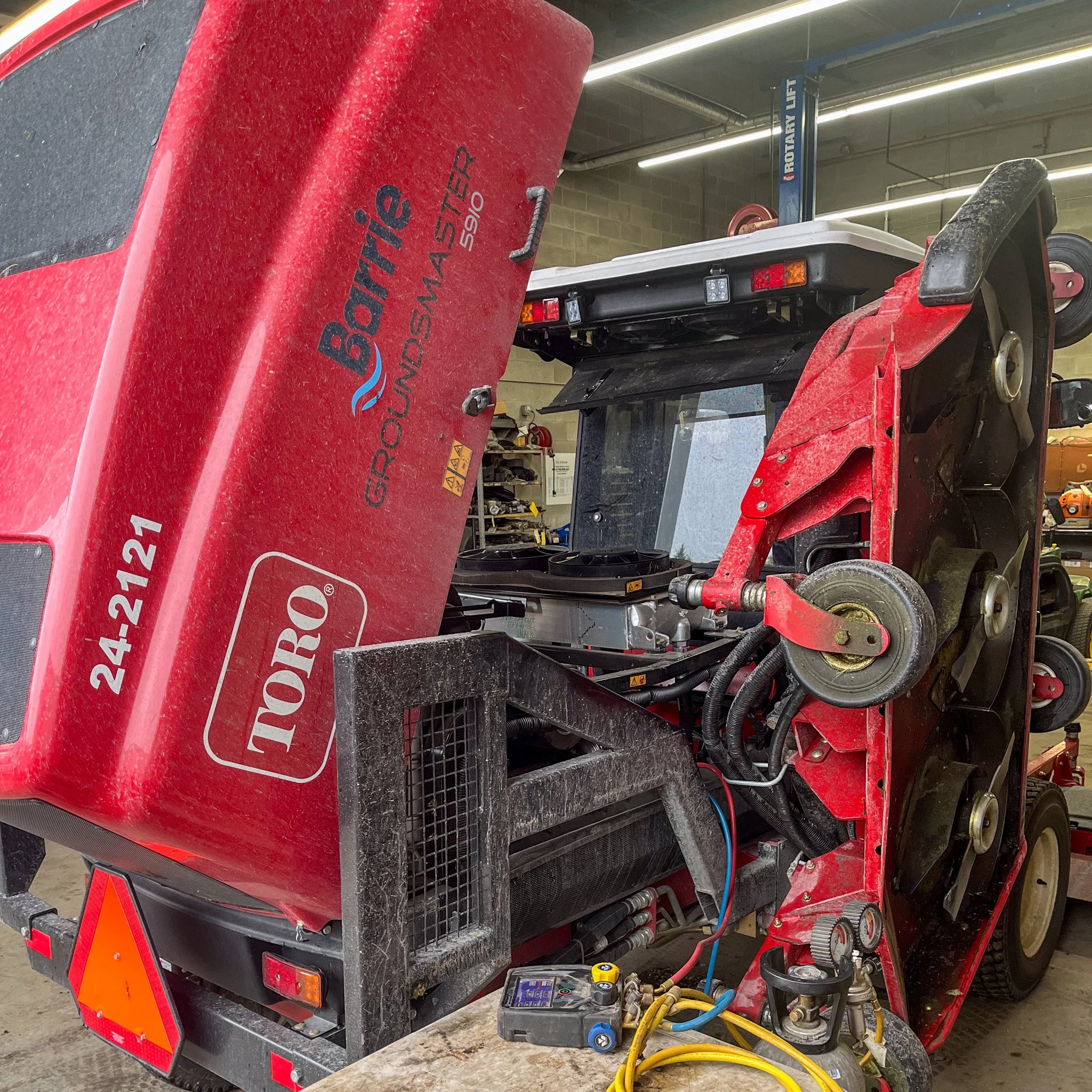 Inside view of a Toro groundsmaster 5210 lawnmower, showing its internal mechanical components and belts.