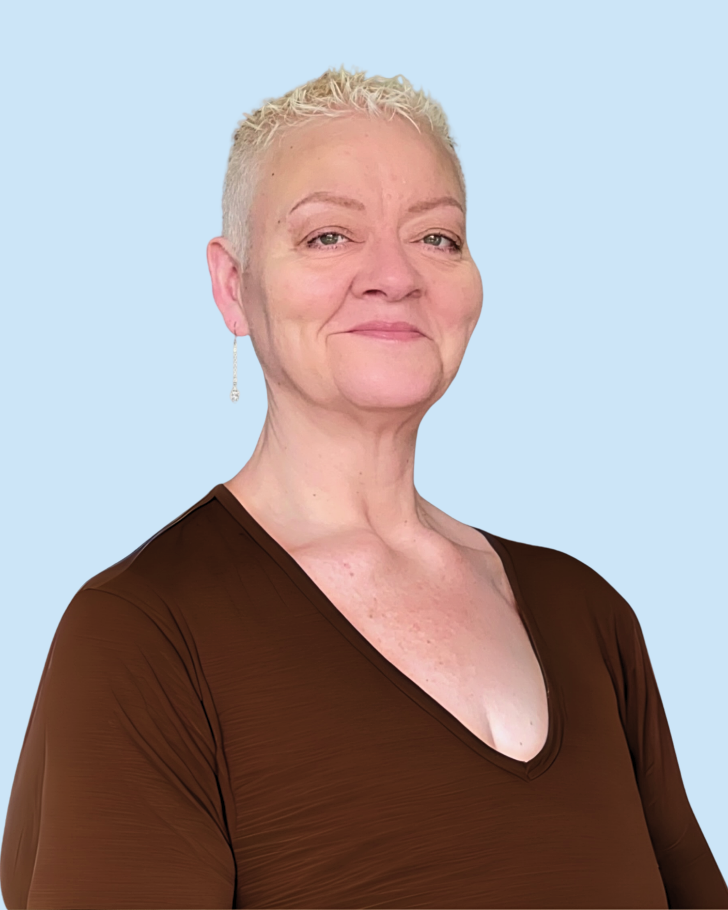 A woman with short, blonde, spiky hair, wearing a brown top with a V-neck, and a long, dangling earring on her left ear, standing against a light blue background.
