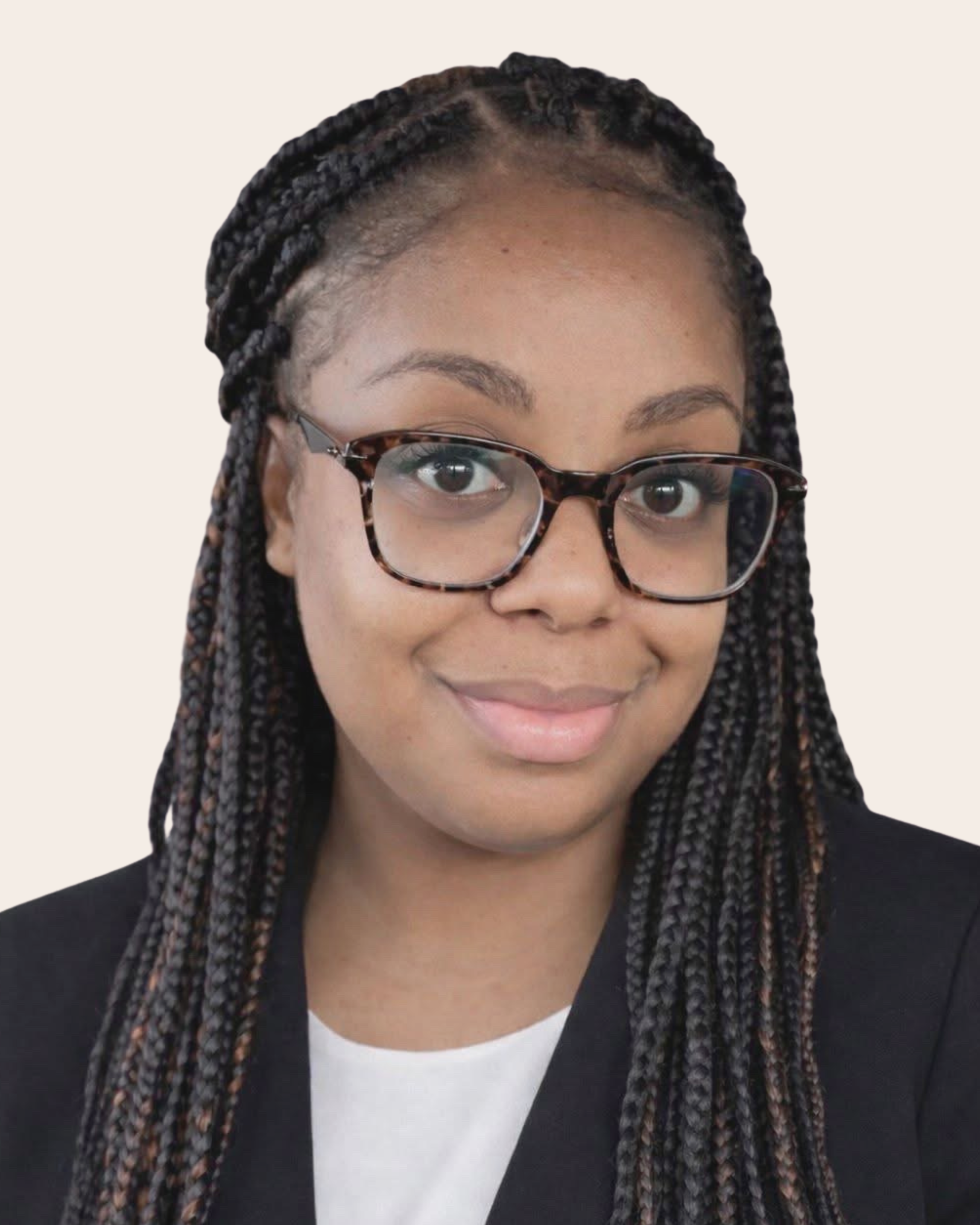 A young woman with blonde hair, wearing glasses, earrings, a nose ring, and a necklace, smiling outdoors against a neutral background.