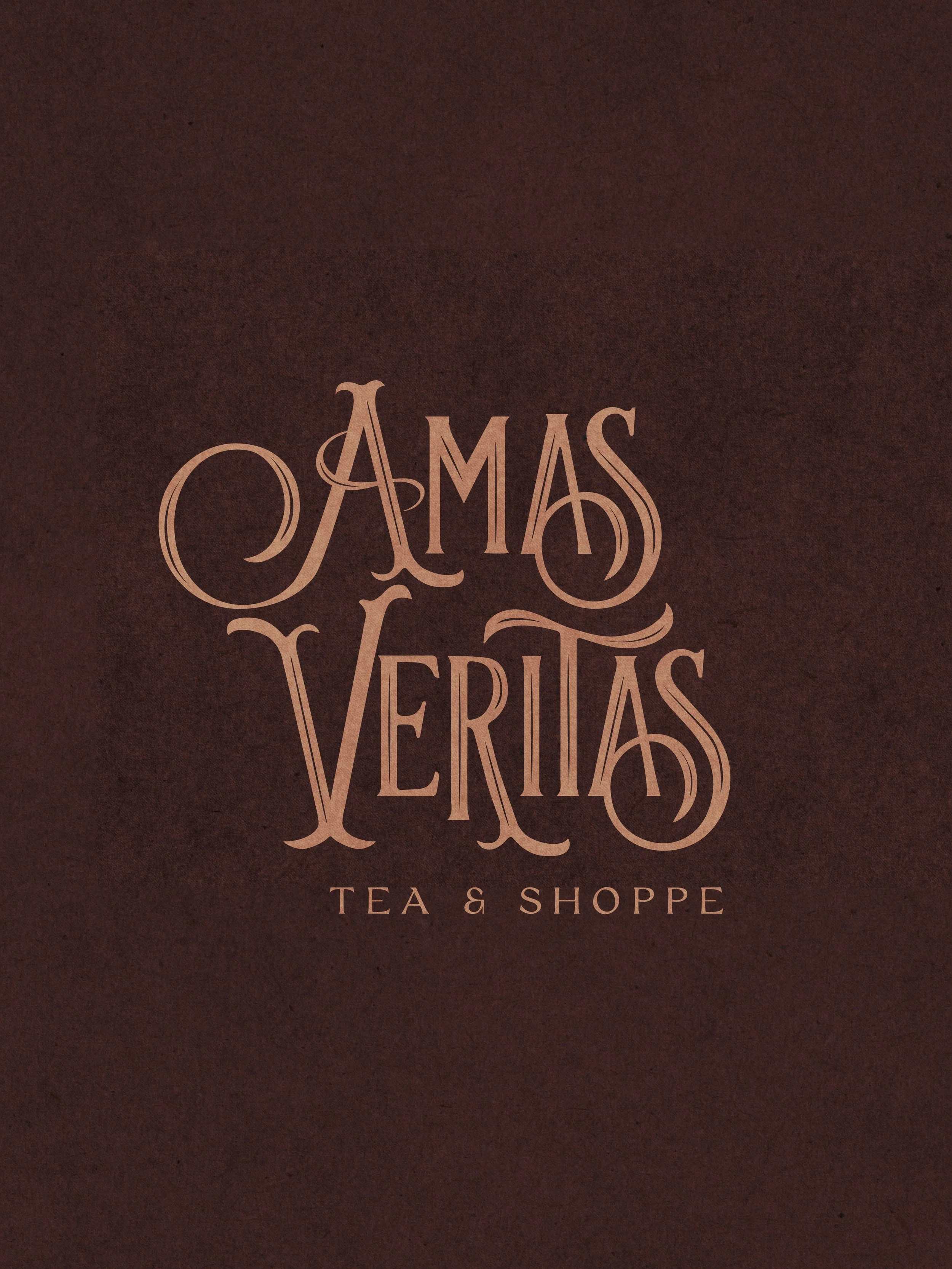 Logo for Amas Veritas Tea & Shoppe in stylized text on a dark background.