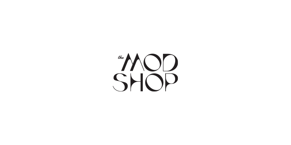 Black background with the logo 'the MOD SHOP' in stylish white font centered.