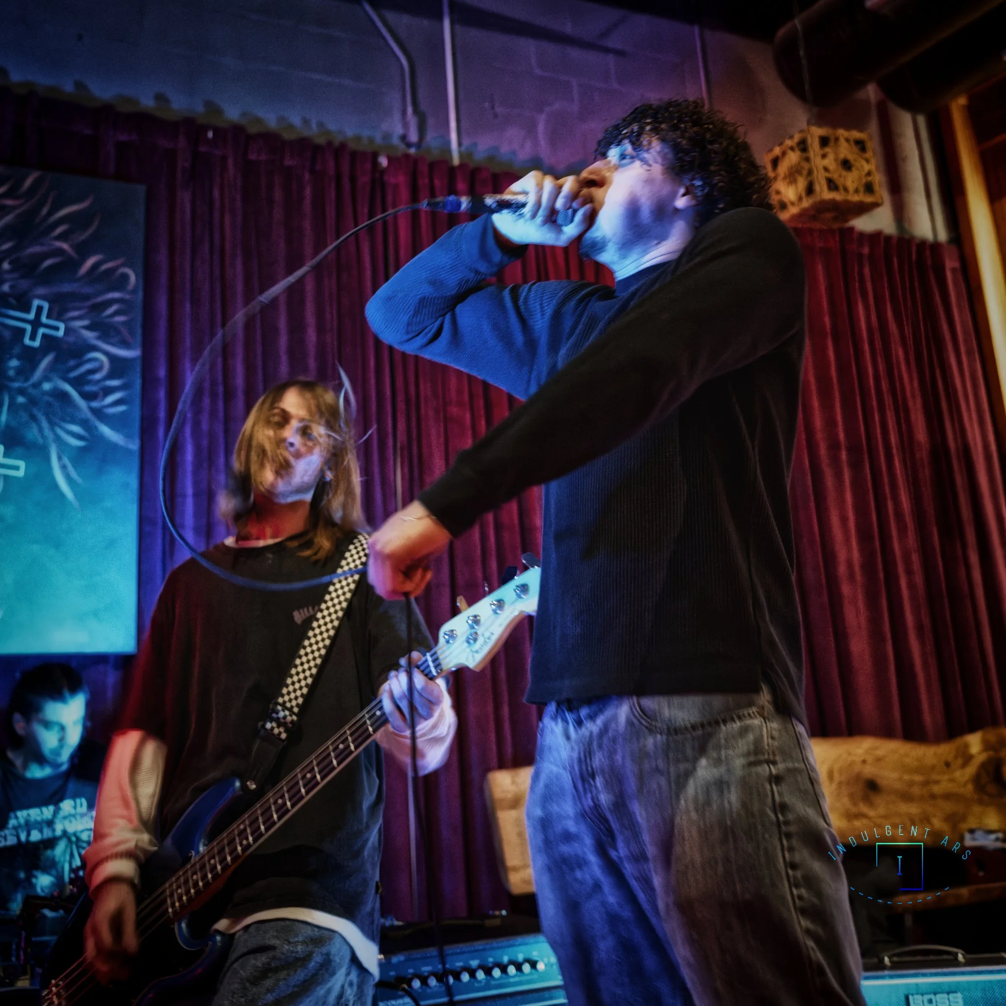 The Librarians' drummer, bassist, and lead vocals, captured here in action. 