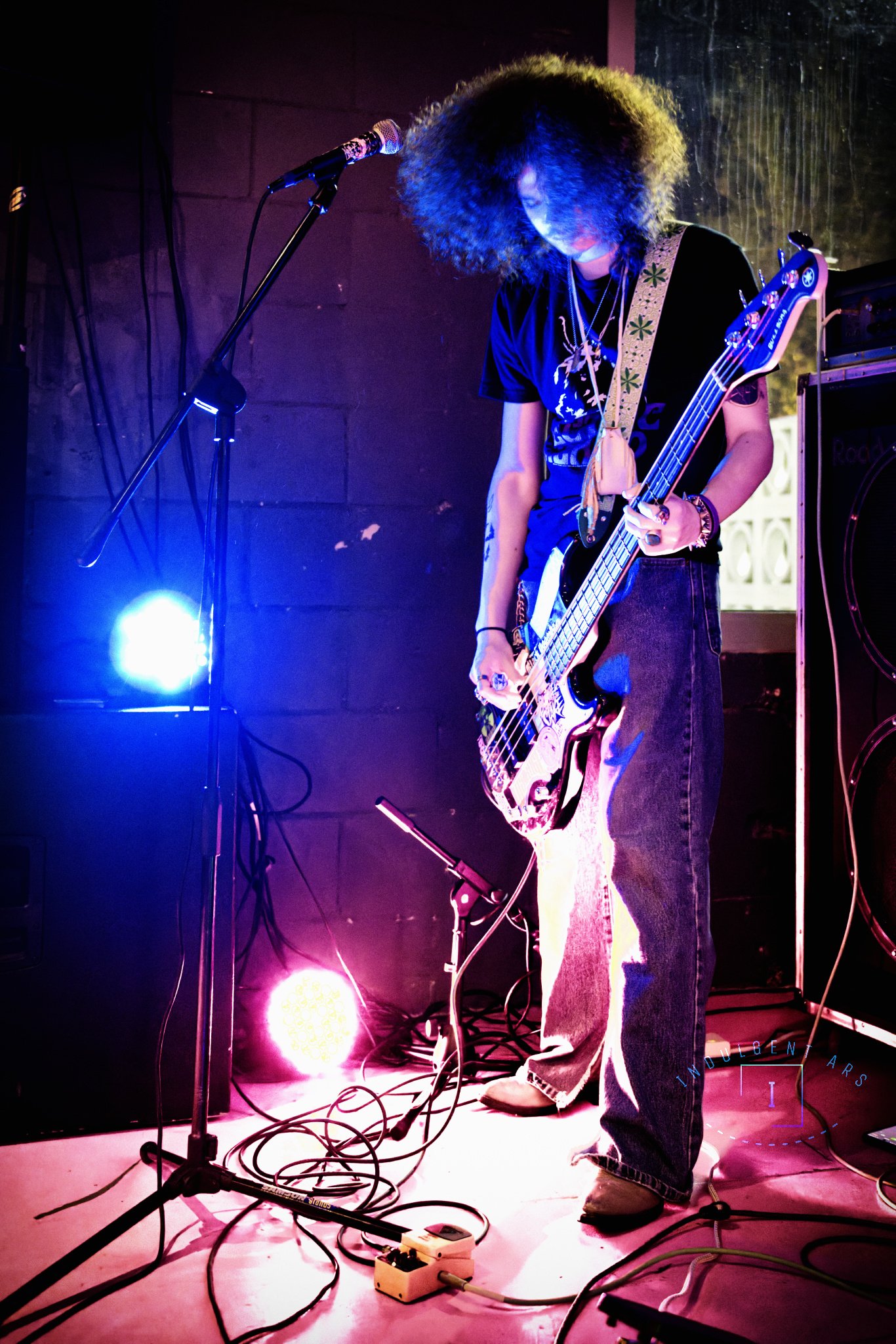 Veneficus Doom's bassist and vocals is captured in action. 