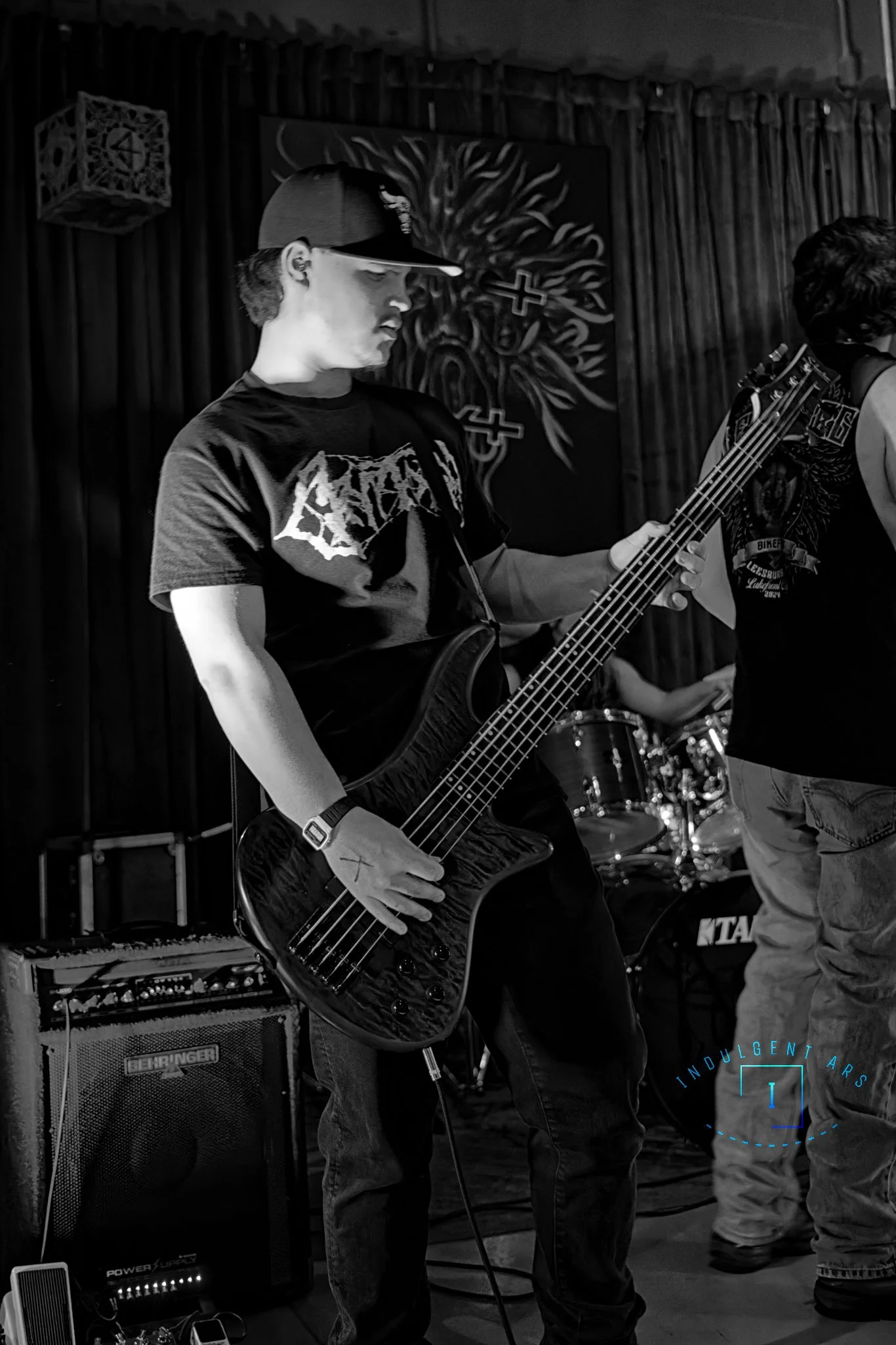 Corpse Corrosion's bassist captured in action. This photo is shot in high contrast B&W.