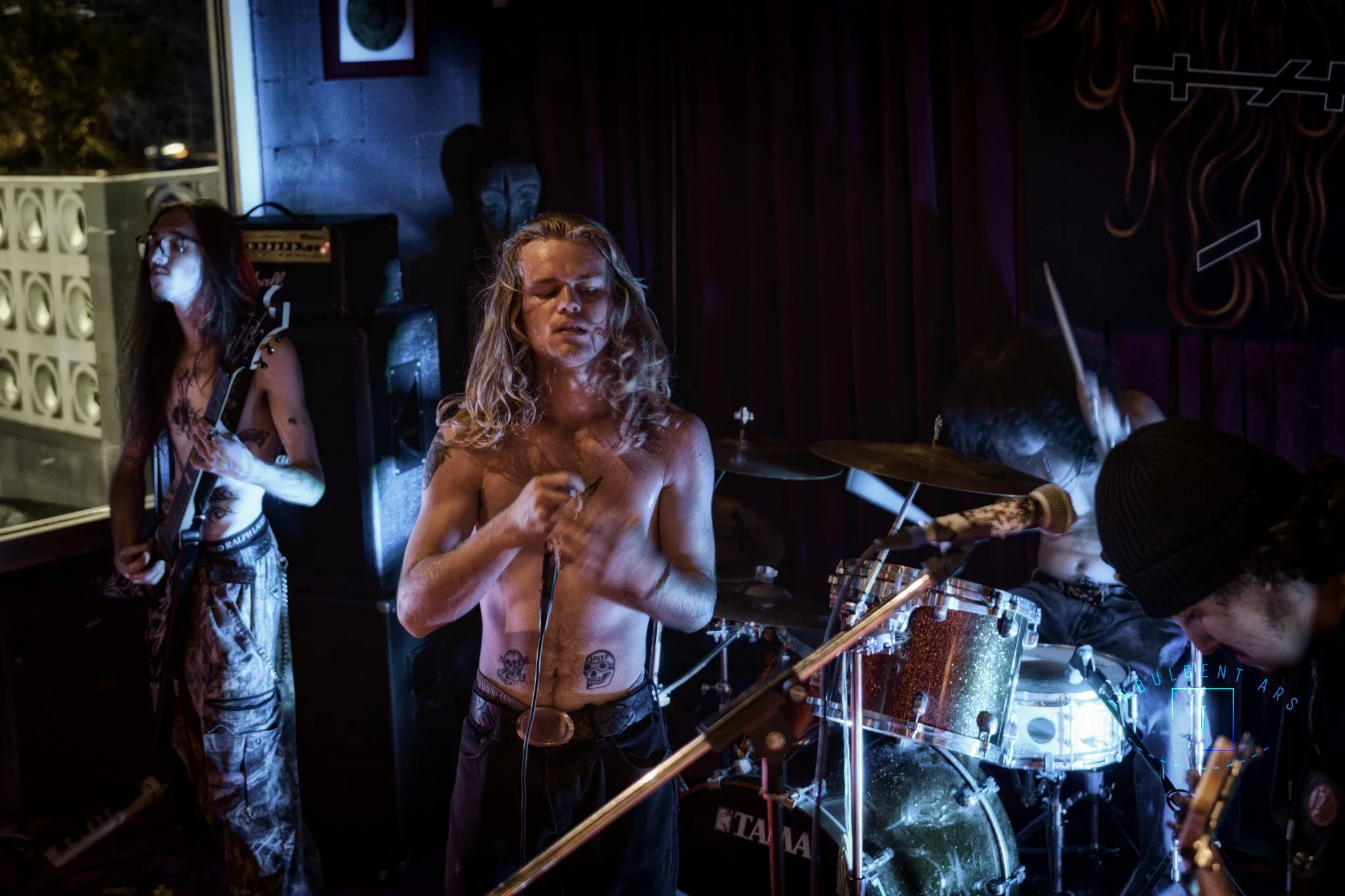 Slowrot captured in action. From left to right we have the guitarist, lead vocals, drummer, and bassist.