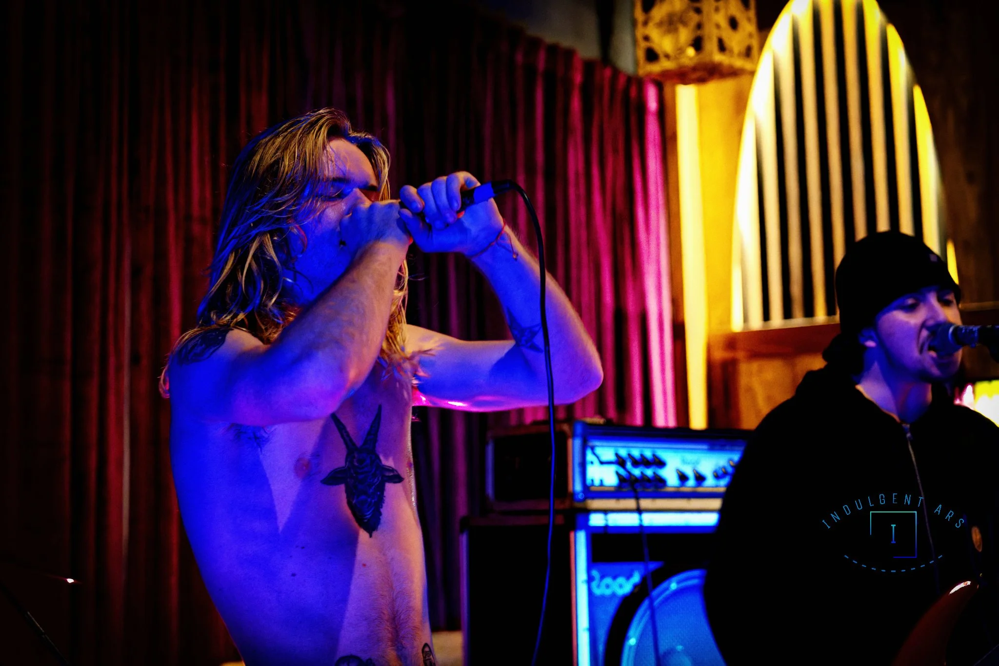 Slowrot's lead vocals and bassist captured in action.