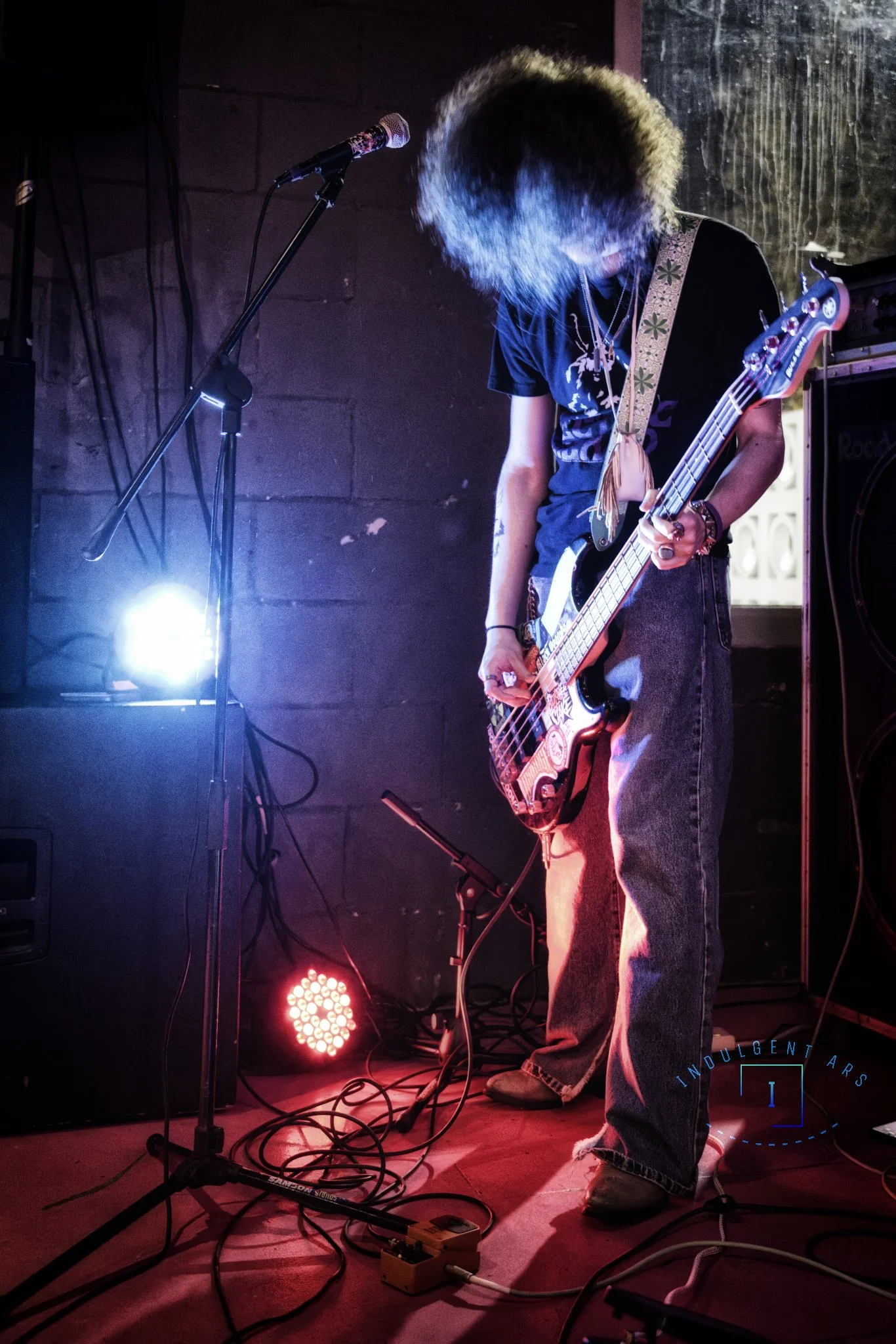 Veneficus Doom's bassist and vocals is captured in action. 