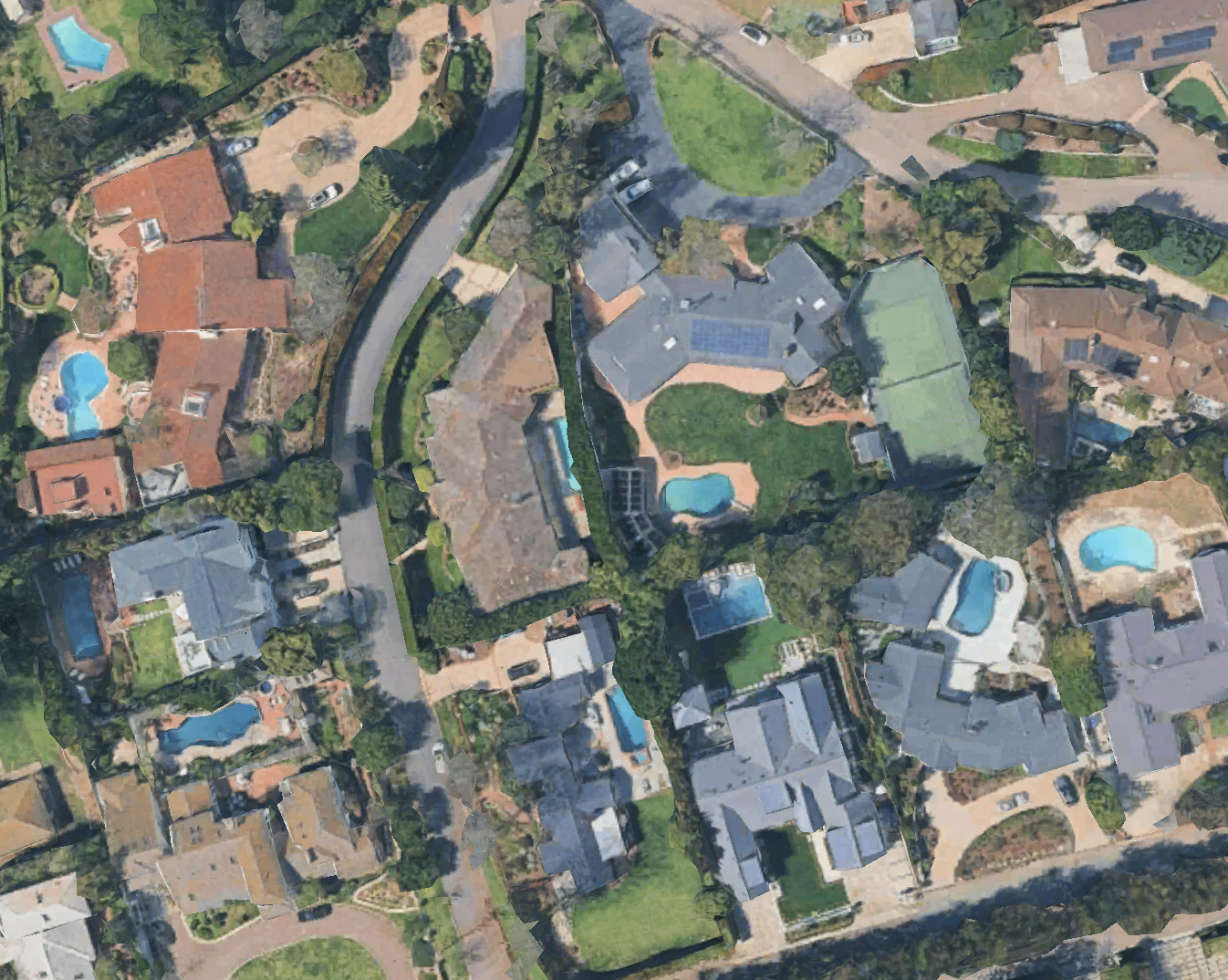 Aerial drone canvassing of a residential neighborhood with multiple roofs, solar installations, and swimming pools.