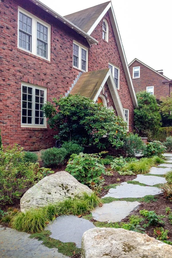 Large Goshen stone steppers leading uphill with bench boulders in the foreground