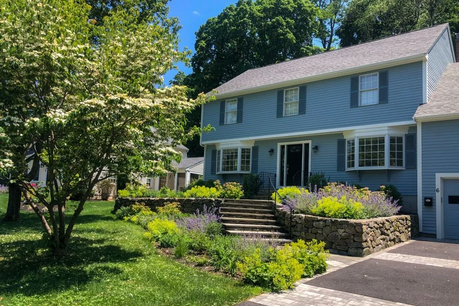  Front yard plantings with curving bluestone tread steps leading to front door 