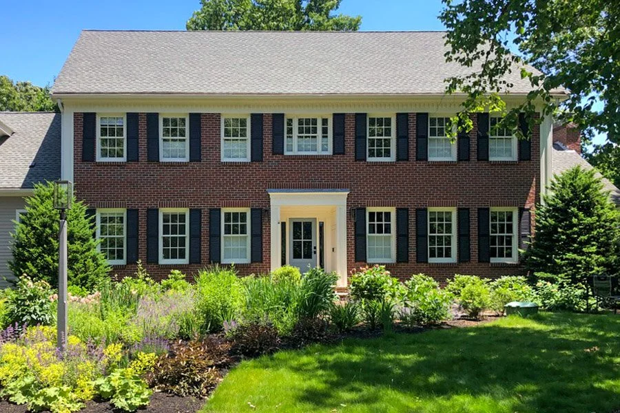  Front yard plantings with half blooming perennials and half no mow lawn 