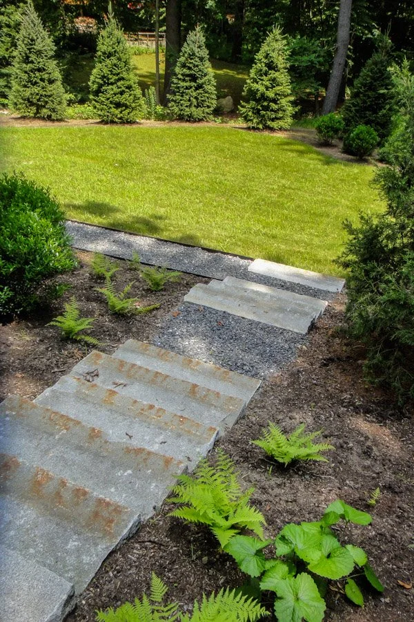  Antique granite curbing as treads leading to lower lawn area 