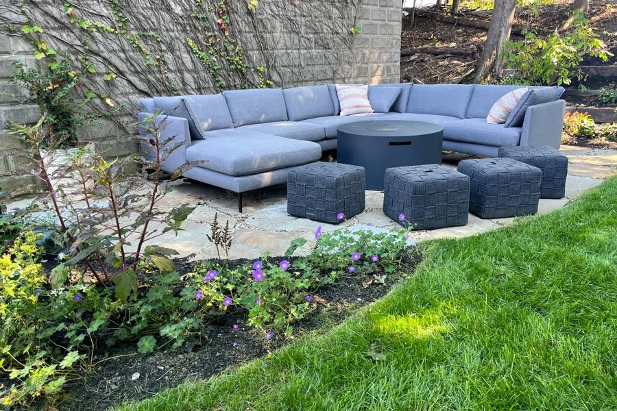  Newly planted hillside with perennials and shrubs with new lawn for play 