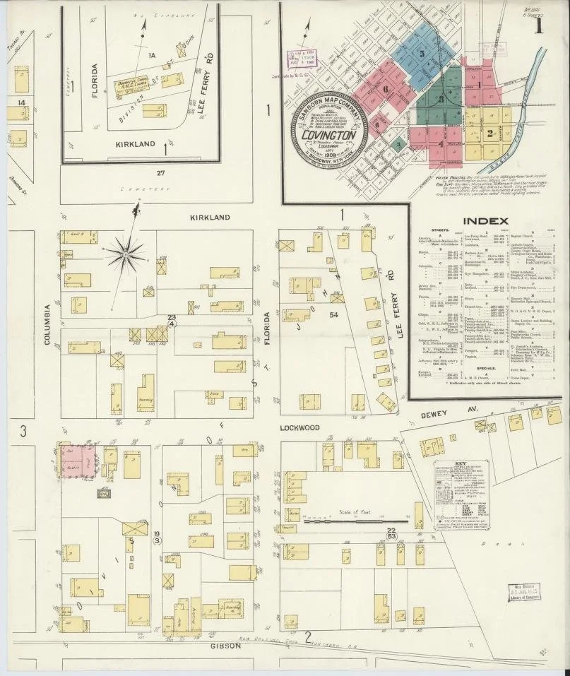 Historical map of Covington, depicting streets, property plots, and buildings with color coding, including a key and index for streets and properties.