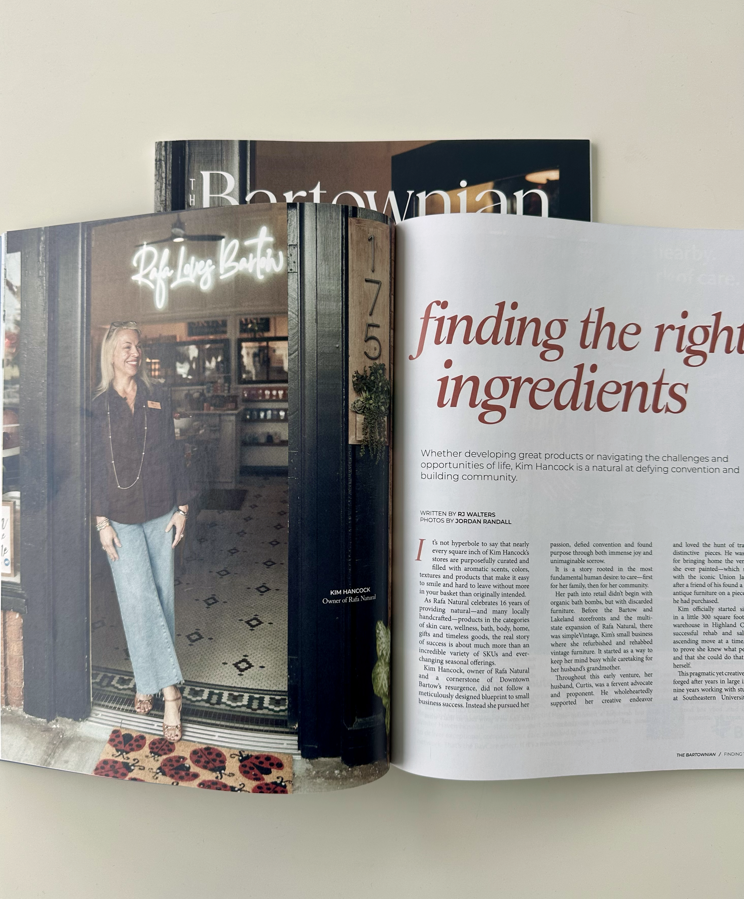 Open magazine featuring an article titled 'finding the right ingredients' with a photo of Kim Hancock standing outside a store at 175.