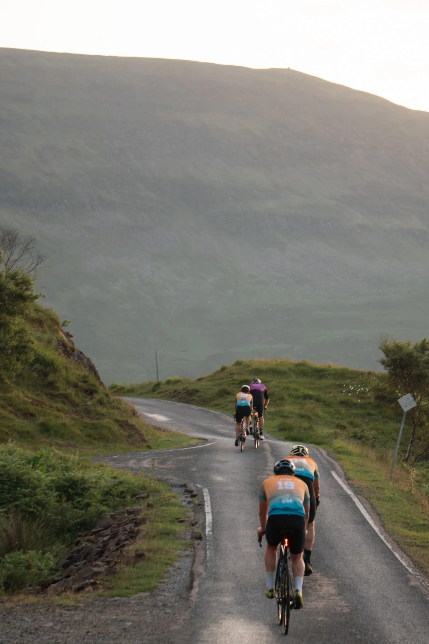 Four Beat the Sun 2025 cyclists tackle one of the many short climbs between Salen and Kilchoan .