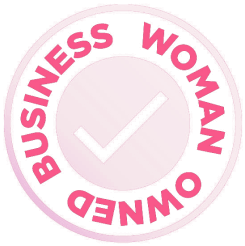 Circular badge with pink border and text reading 'Business Woman Owned' around a checkmark.
