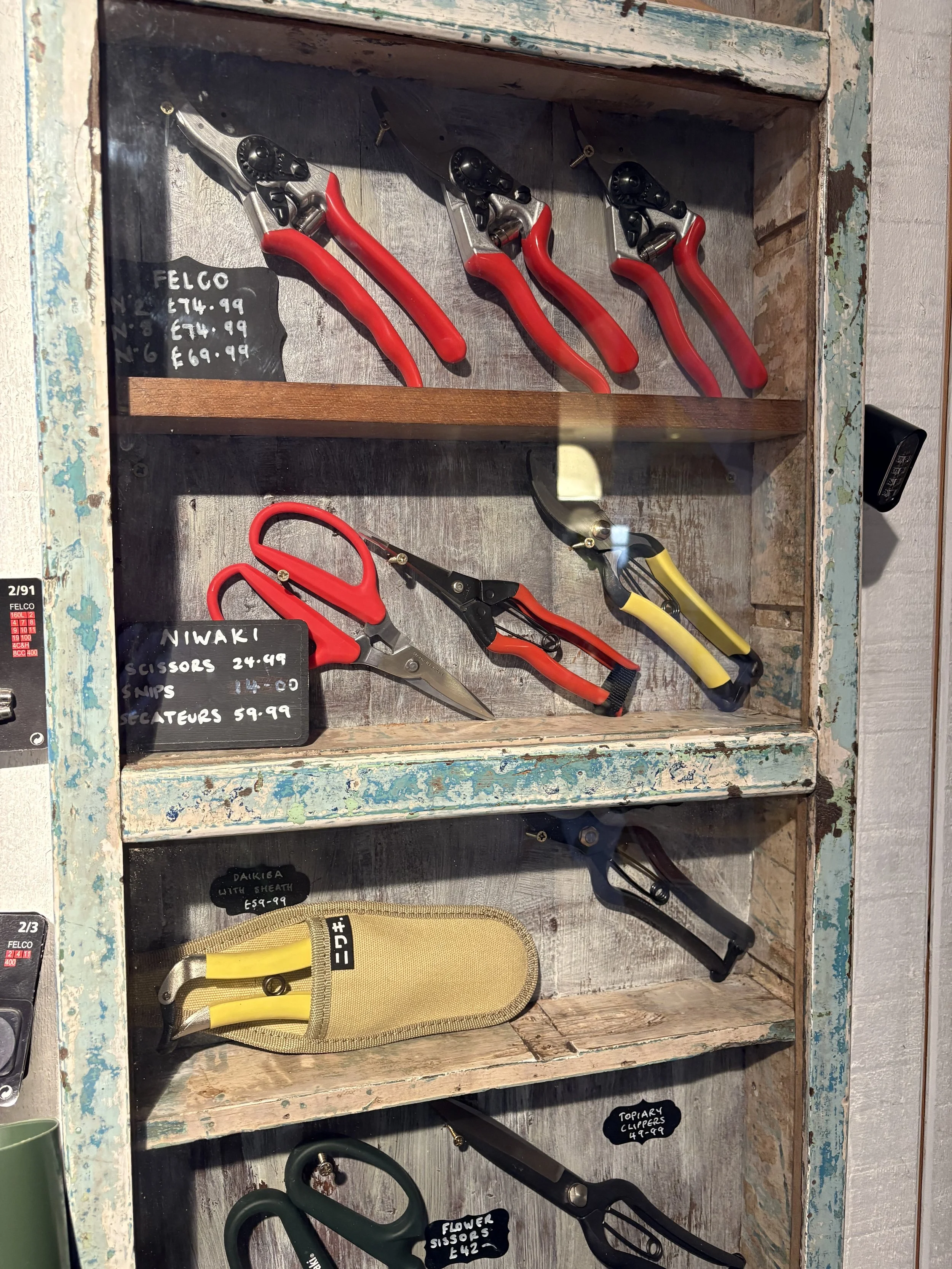 Niwaki and Felco secateurs in a distressed wooden case