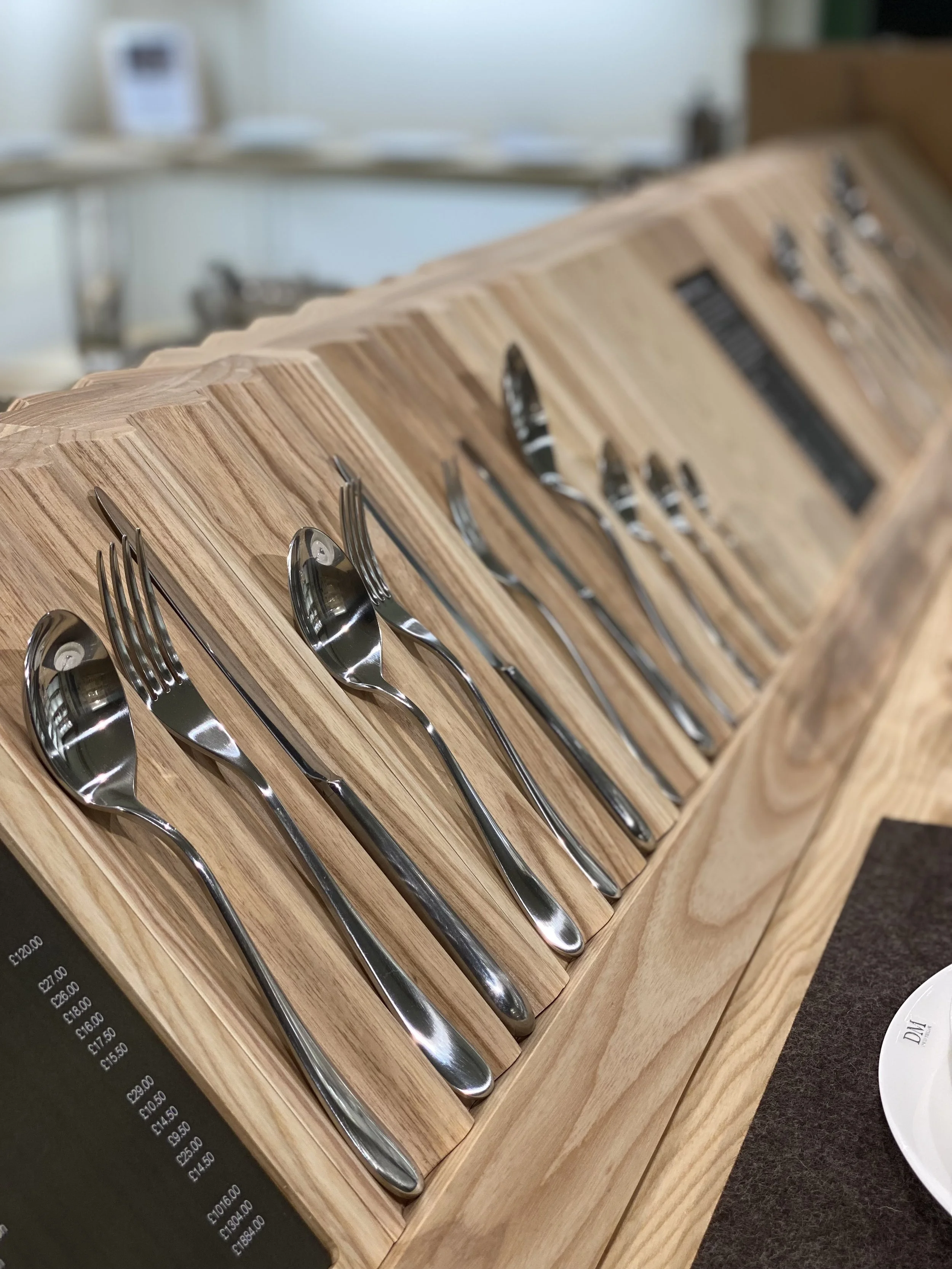 British craftsmanship steel cutlery in wooden shelf