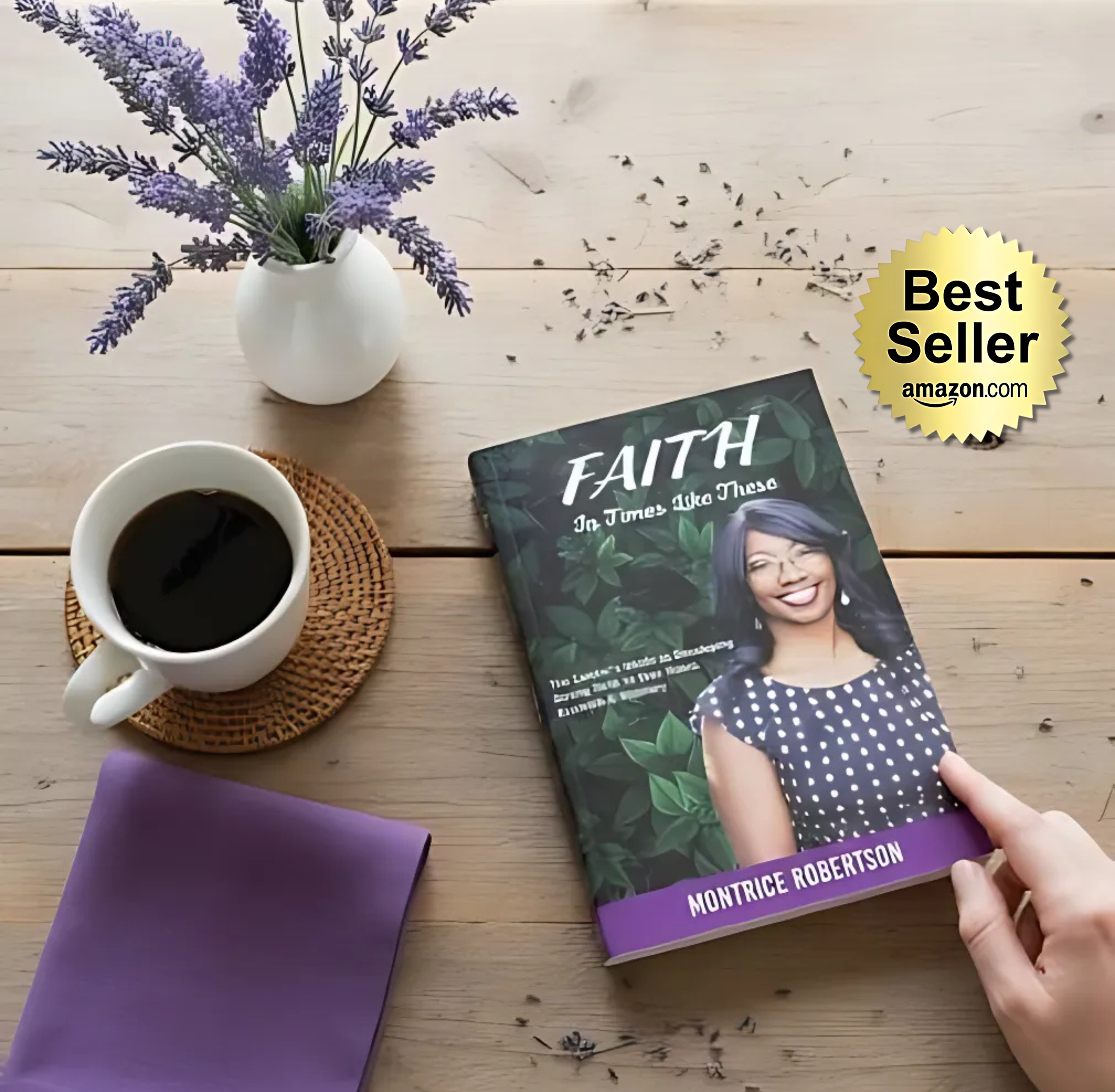 A wooden table with a white vase of lavender flowers, a cup of coffee on a woven coaster, a purple-covered notebook, and a book titled 'Faith' by Montrice Robertson, with a 'Best Seller' badge from Amazon in the corner.