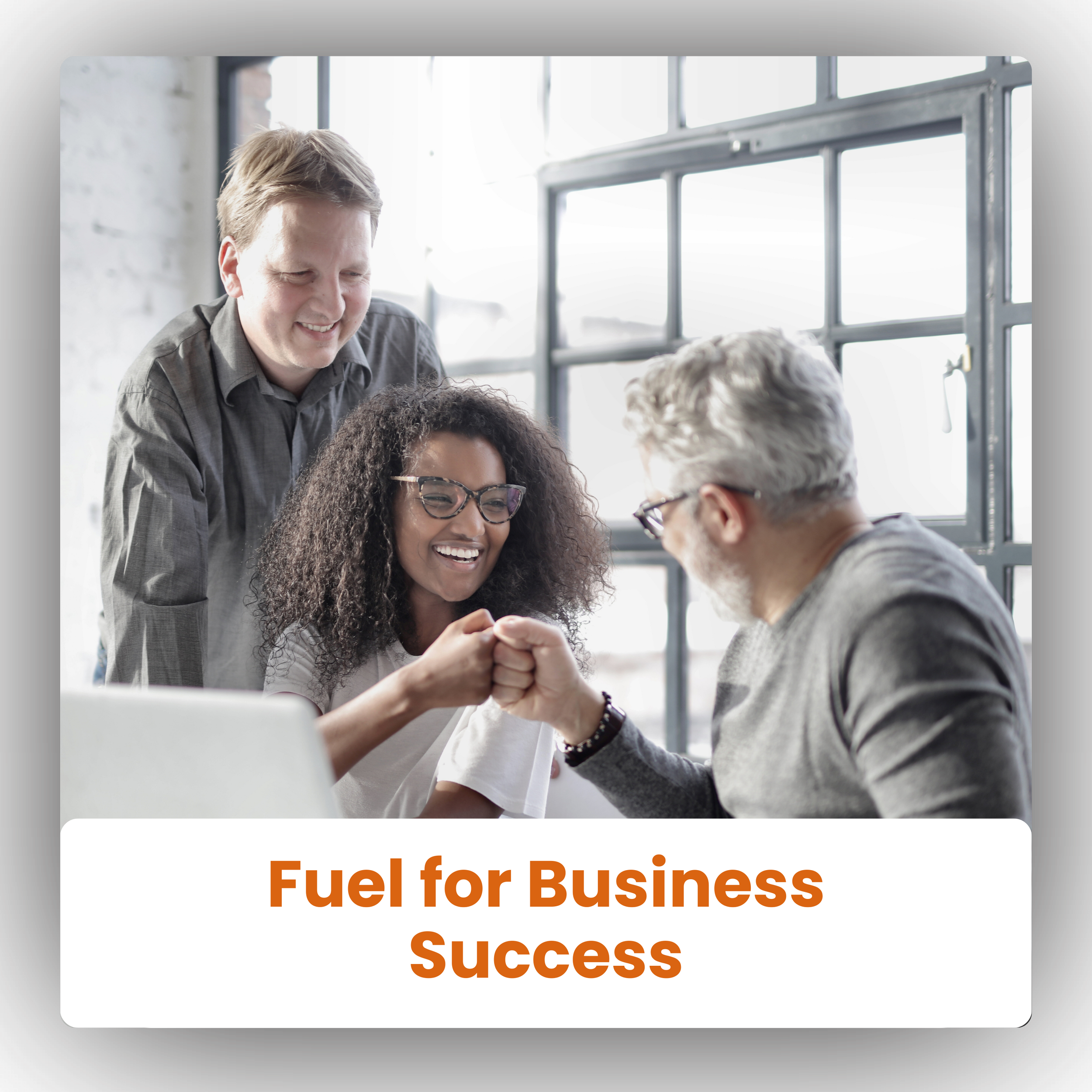 A diverse group of three people in a modern office, two men and one woman, smiling and fist-bumping each other, with a caption that reads 'Fuel for Business Success'.