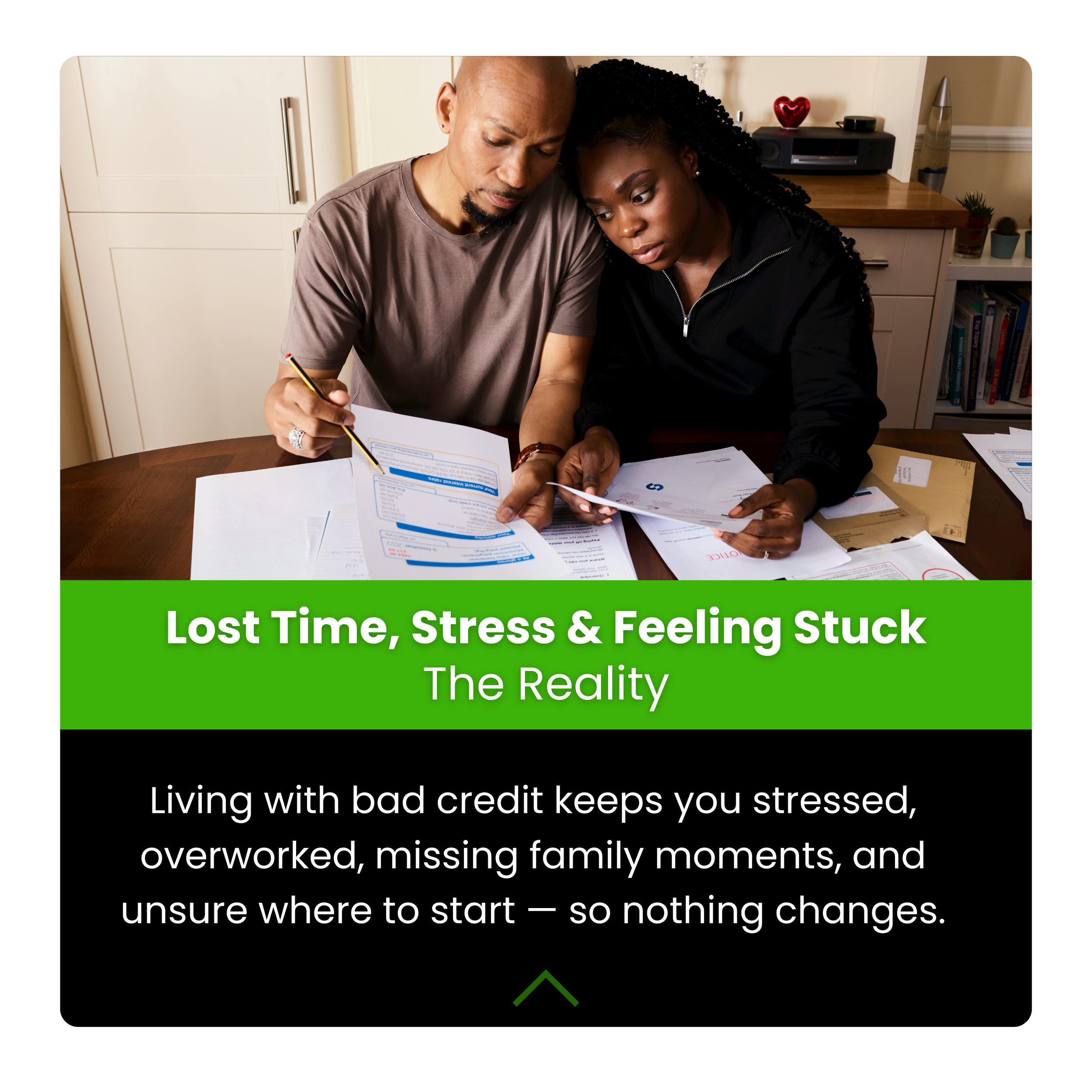 A couple sitting at a table reviewing documents, possibly talking about finances, with bookshelves and a countertop in the background.