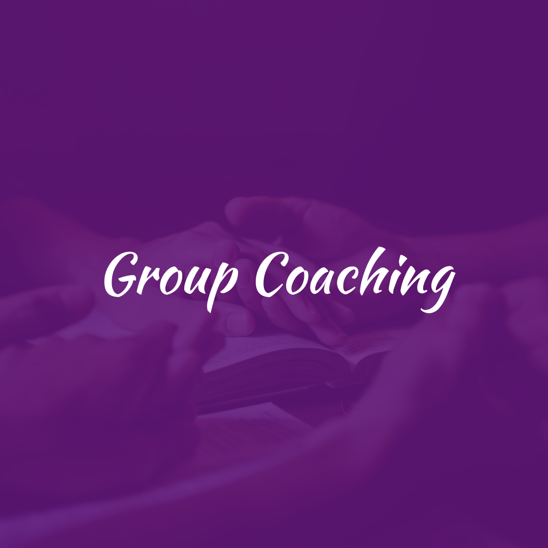 A person holding a book with the text 'Group Coaching' overlaid in white, set against a purple background.