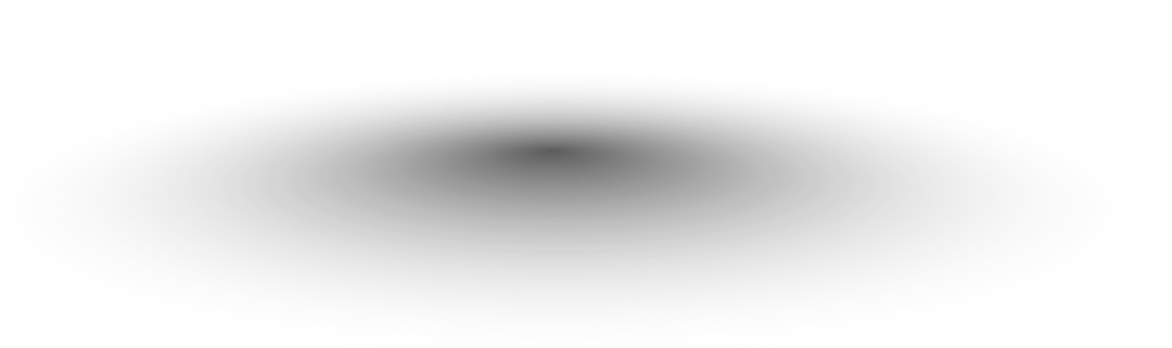 A black and white image of a wave crashing with a person surfing on it.