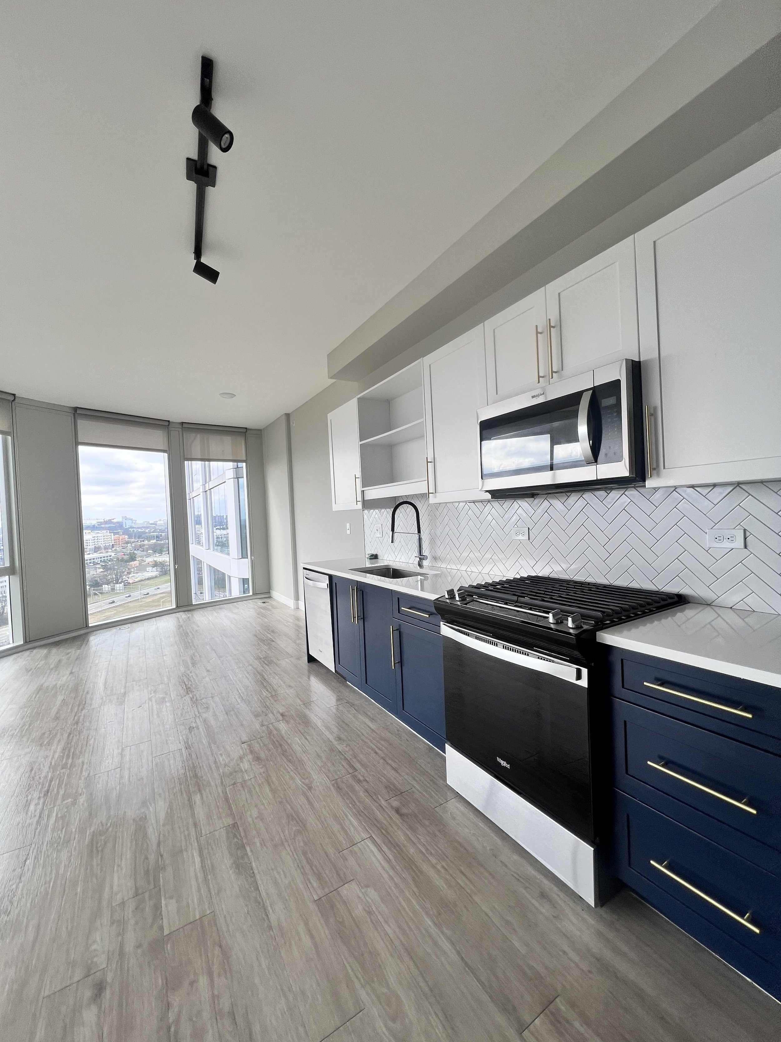Modern kitchen cleaned and polished during professional home cleaning visit.