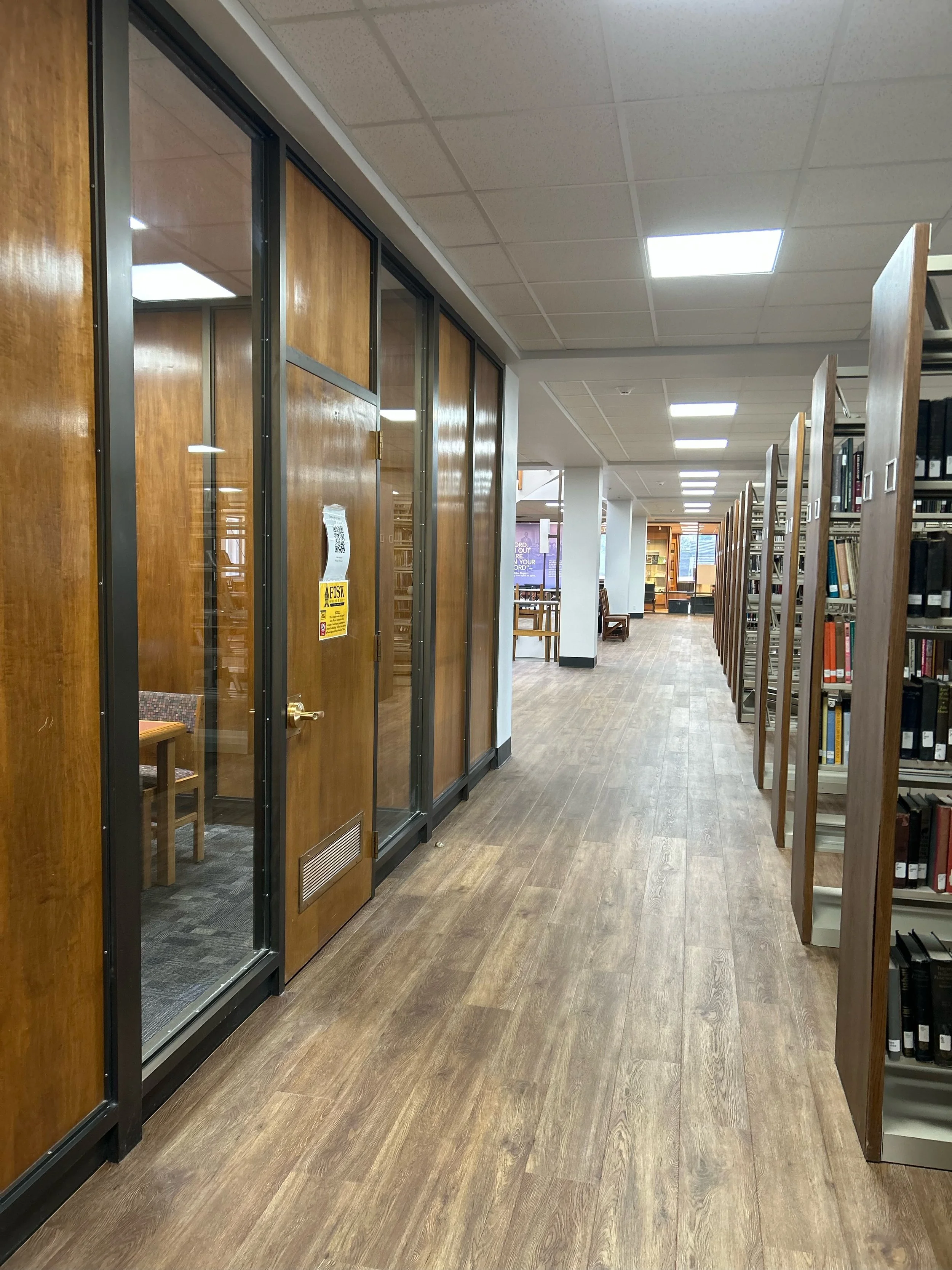 Library hallway maintained through routine commercial cleaning.