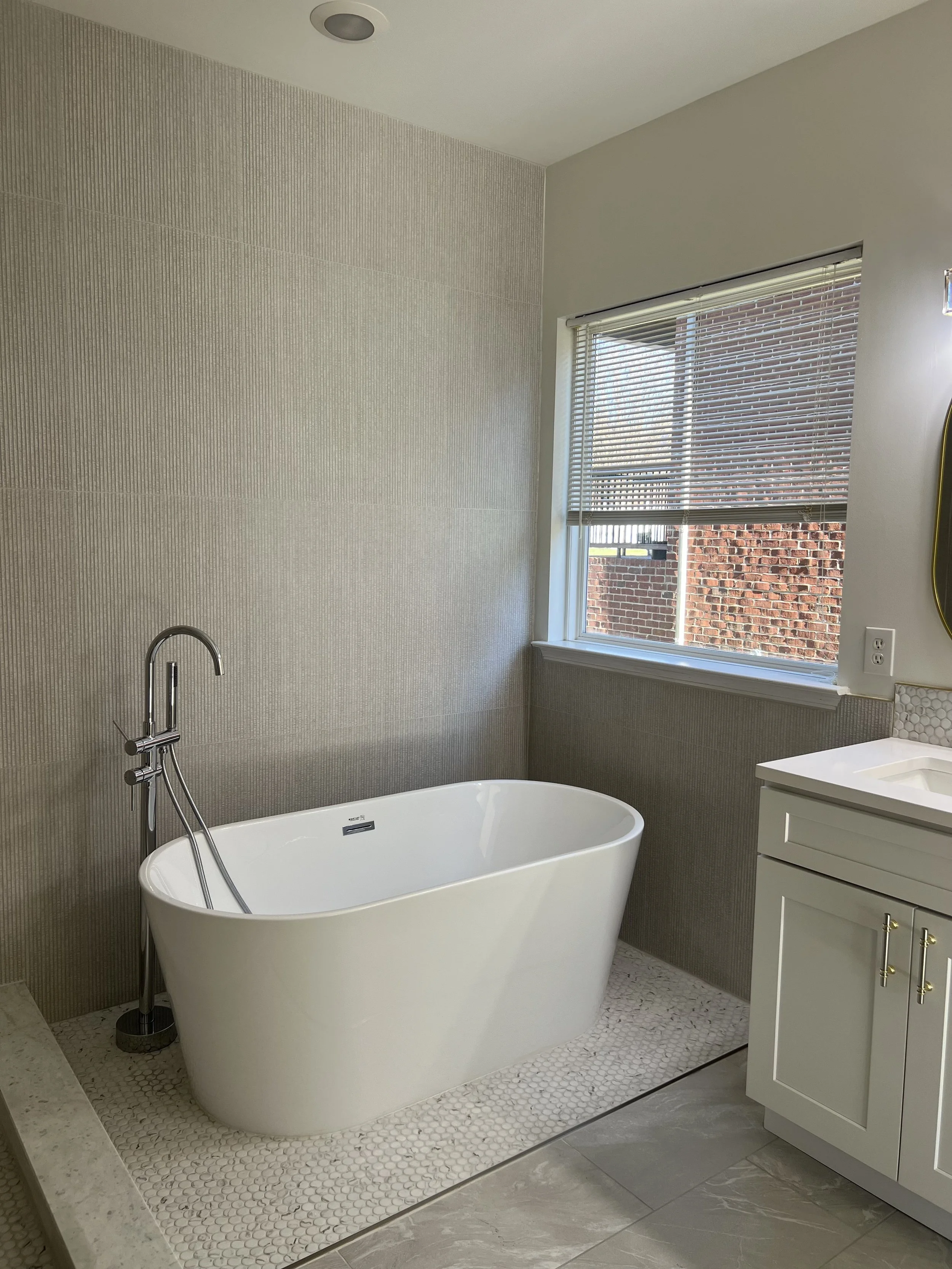 Modern bathroom sanitized during professional residential cleaning visit.