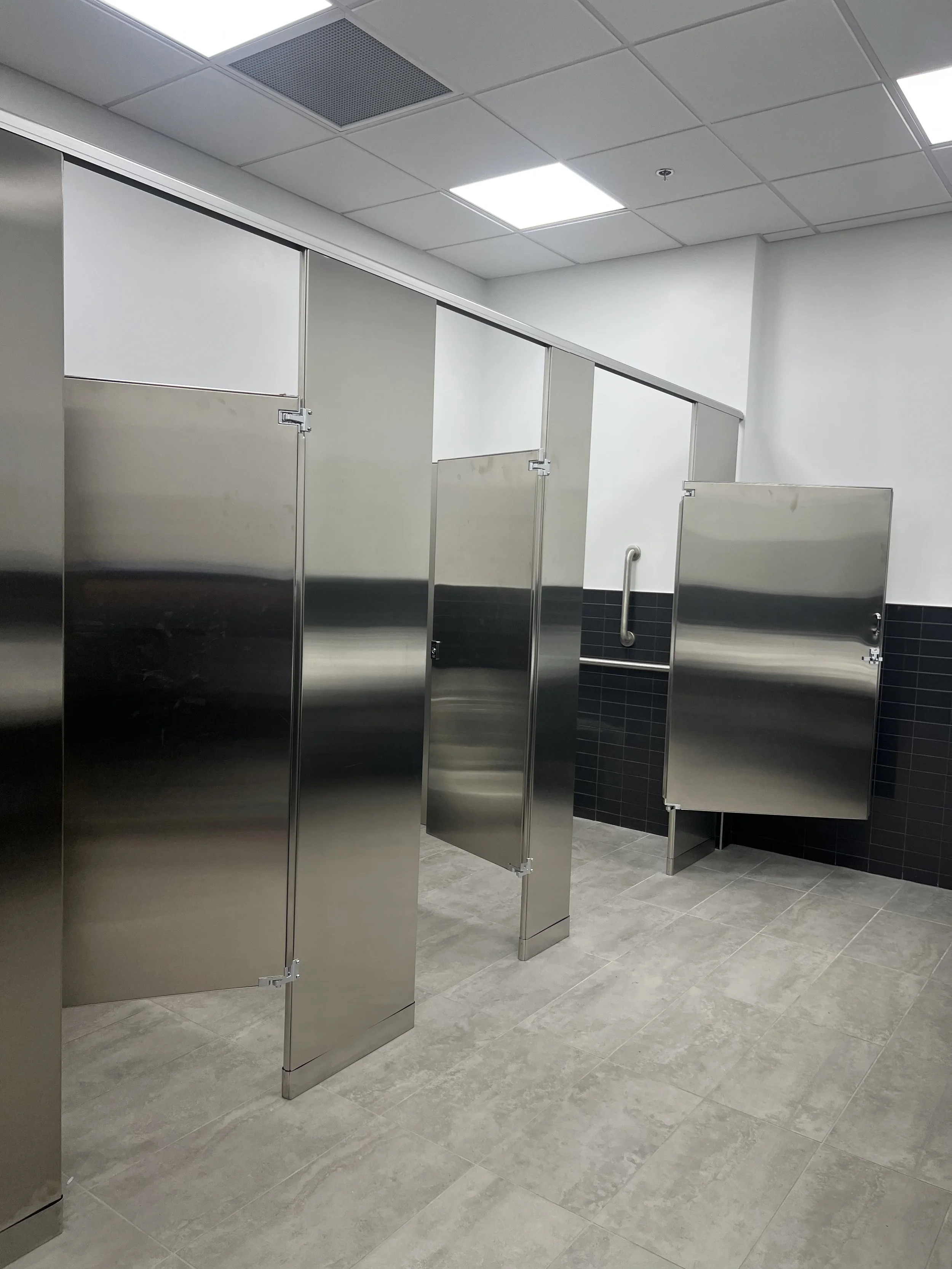 Public restroom stalls cleaned and disinfected professionally.