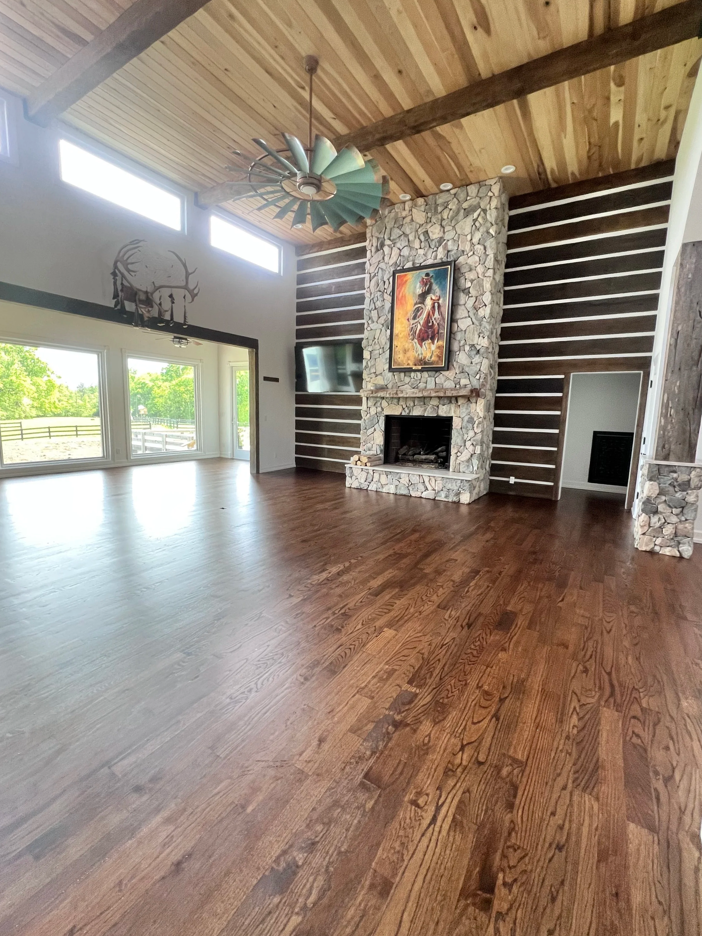 Spacious residential living room prepared after thorough house cleaning service.