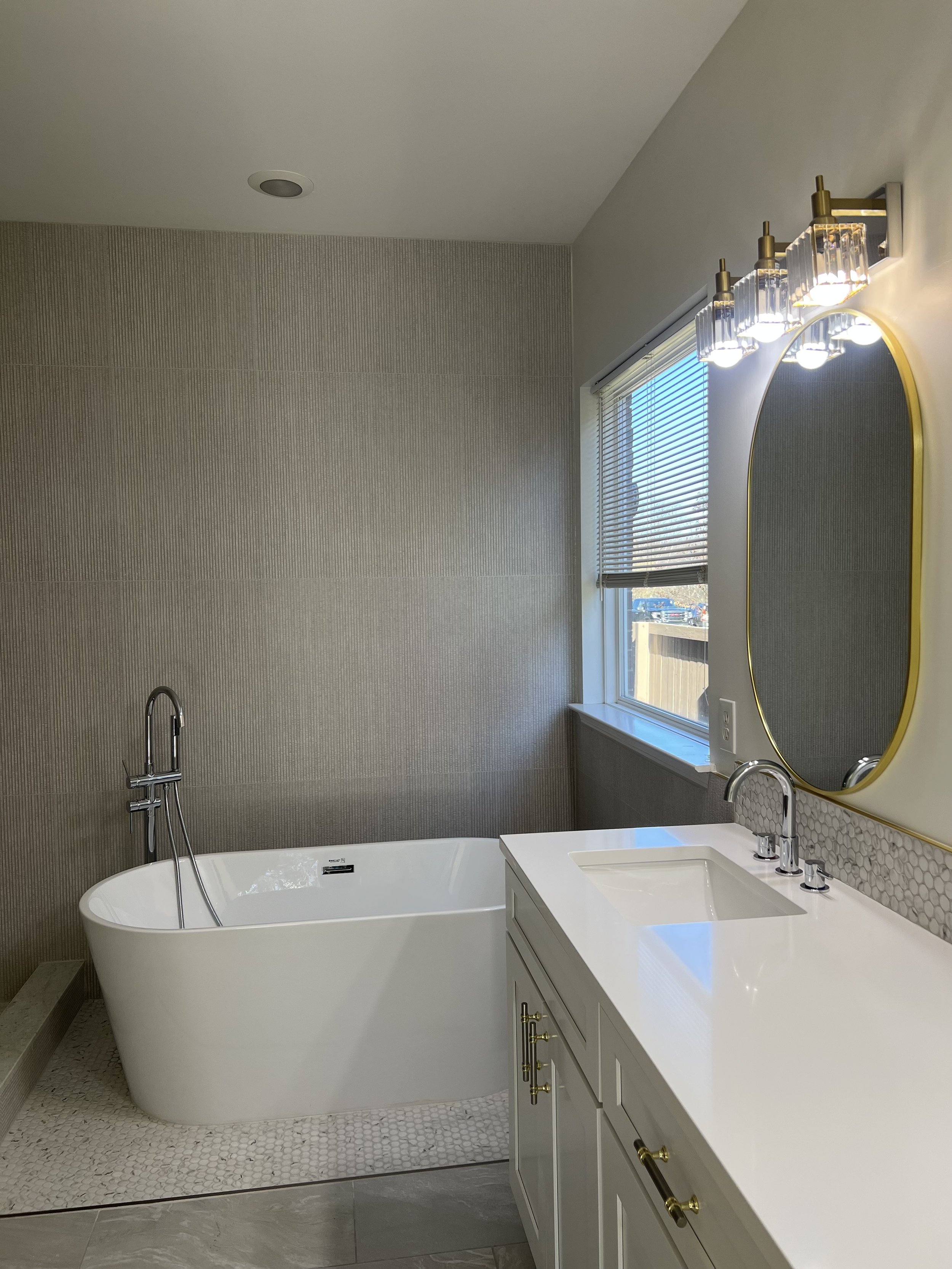 Contemporary bathroom with freestanding tub sanitized during deep cleaning.