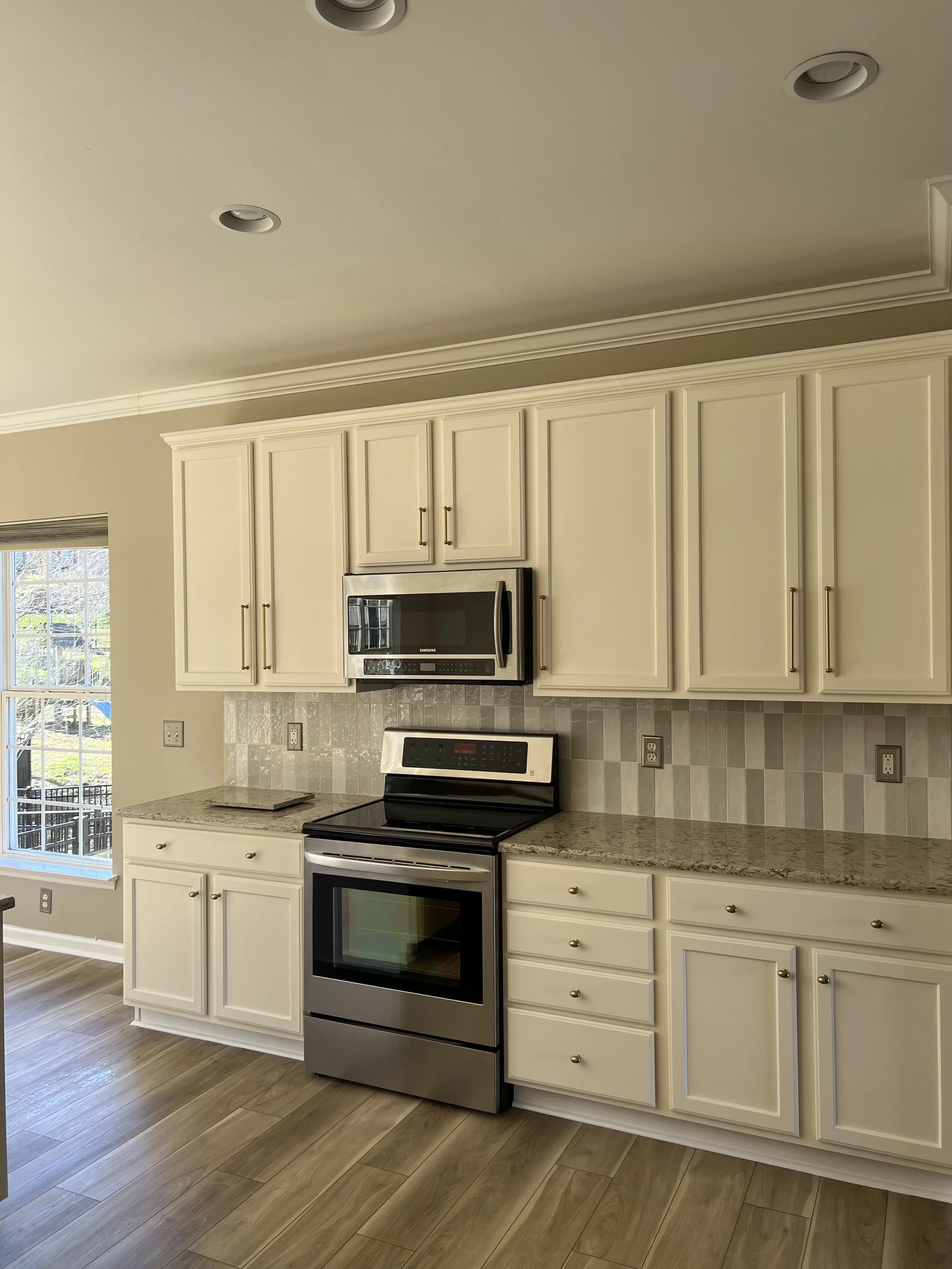 Kitchen thoroughly cleaned including cabinets, countertops, and appliances.