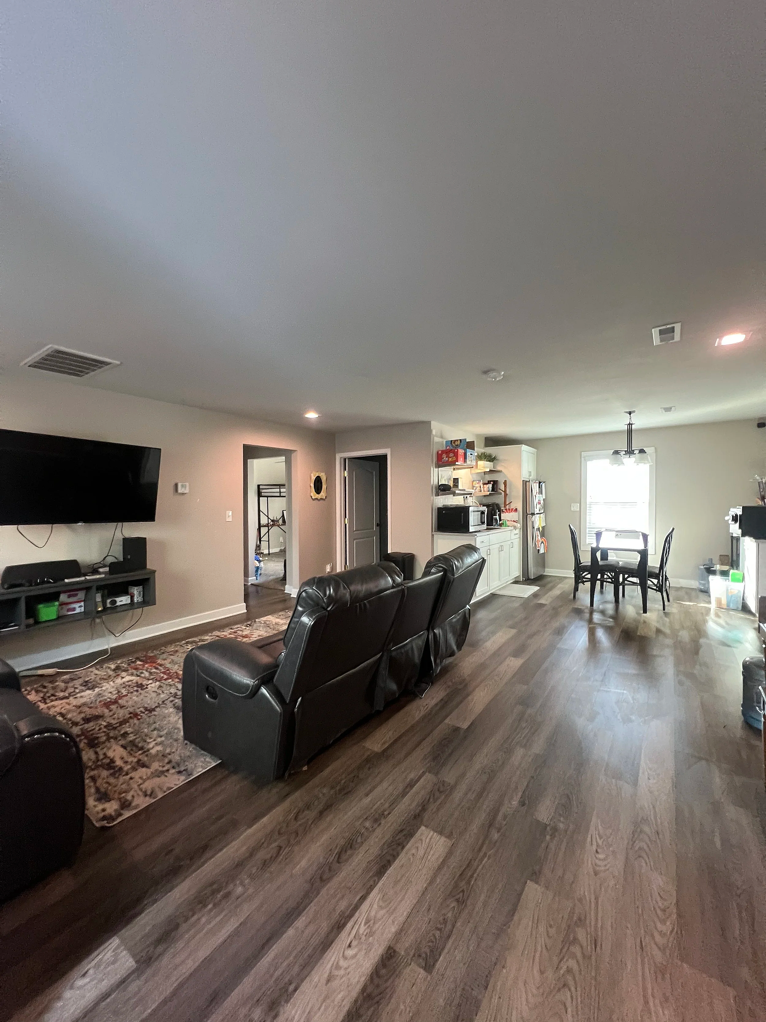 Open living and dining area cleaned during professional residential service.