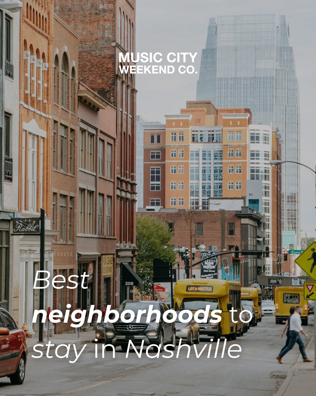 Downtown Nashville street lined with brick buildings and the city skyline