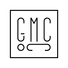 Simple black and white logo with the letters G, M, and C arranged vertically inside a square, with stylized dots and a curved line.
