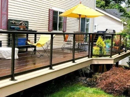 Composite deck with railing built on a sloped residential lot in Sammamish, WA