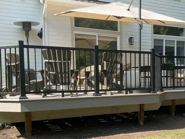 Completed deck replacement in Issaquah, WA with AZEK Coastline PVC decking and black TimberTech aluminum railing.