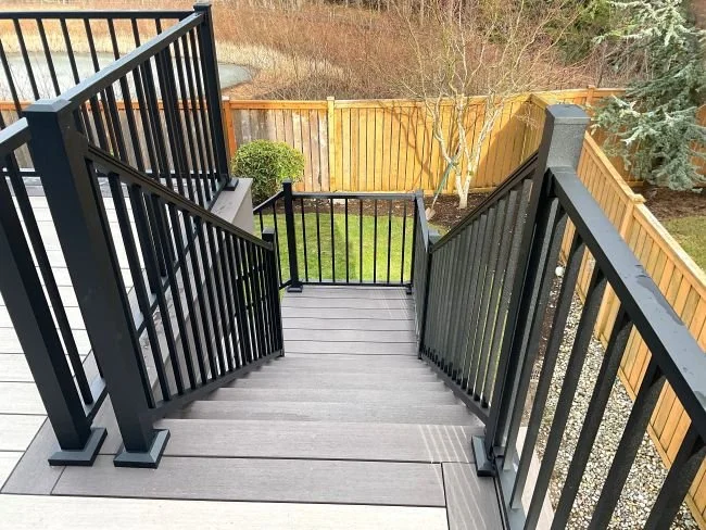 Stair railing installation improving safety on an existing residential deck