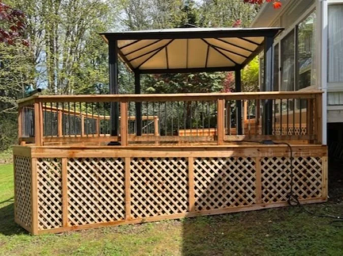 Cedar deck with rebuilt structural components and railing replacement in Renton, WA