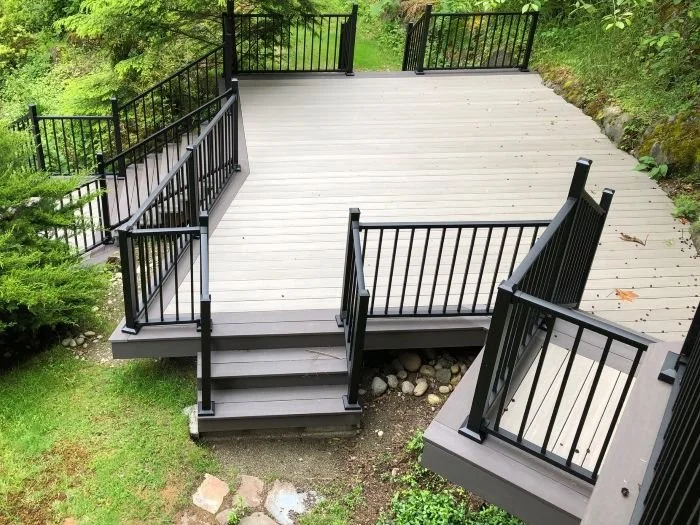 Tiered multi-level deck with platforms connected by stairs across elevation changes